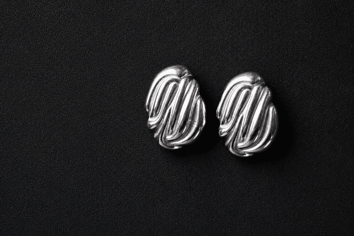 Silver sculpted statement earrings   silver