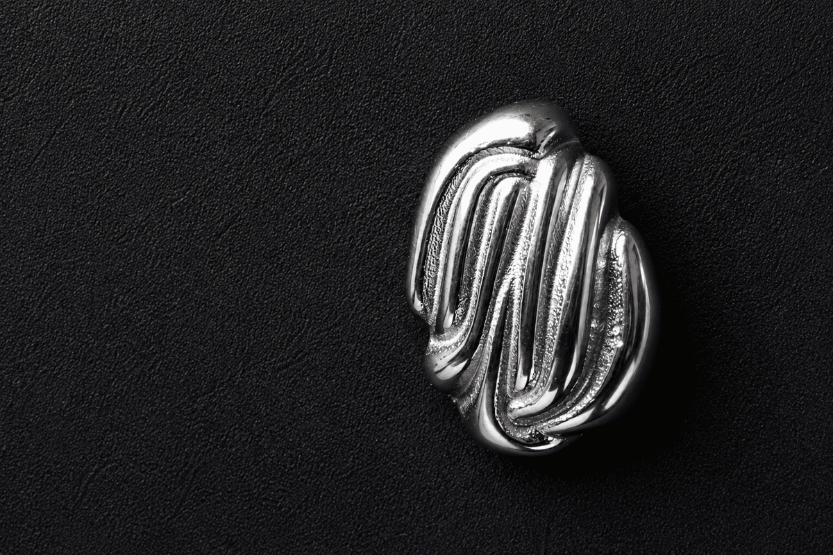 Silver sculpted statement earrings   silver